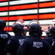 NYPD police officers watch demonstrators in Times Square on June 1, 2020, during a “Black Lives Matter” protest.